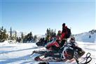 Mountain tour with snowmobile